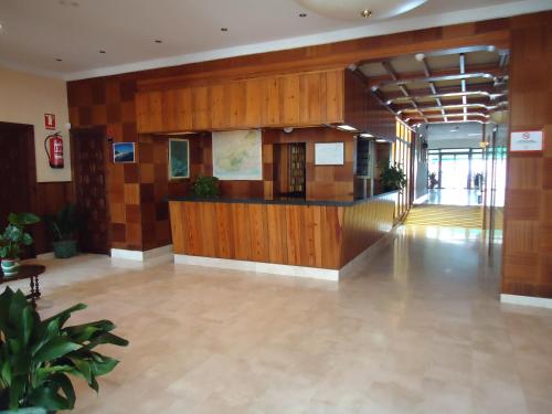 a lobby with a reception desk in a building at Hotel las Conchas in La Rábita