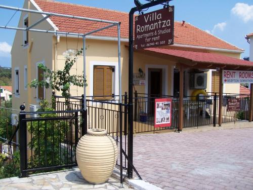 a large vase sitting in front of a building at Villa Romantza in Fiskardho