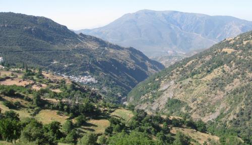 a view of a valley in a mountain range at Alojamientos Rurales Benarum con Spa in Alpujarra De La Sierra
