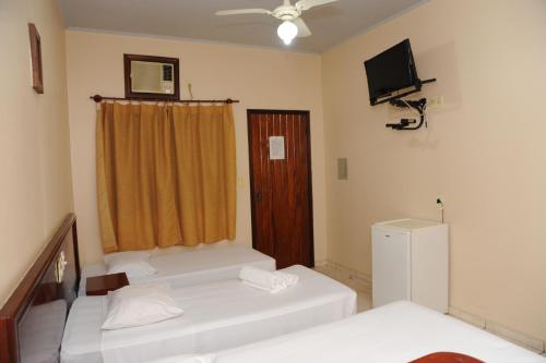 Giường trong phòng chung tại Hotel Varandas Araraquara