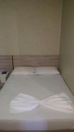 Ένα ή περισσότερα κρεβάτια σε δωμάτιο στο Hotel Boiadeiro