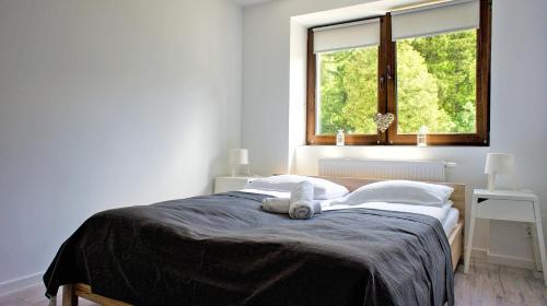 Posteľ alebo postele v izbe v ubytovaní Apartamenty Karkonoskie