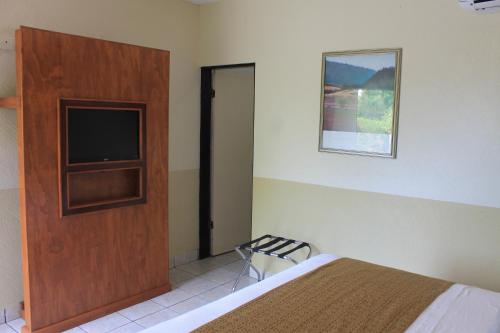Ένα ή περισσότερα κρεβάτια σε δωμάτιο στο Hotel Hacienda del Viejo