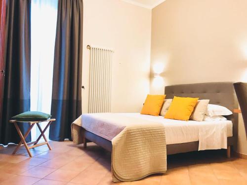 a bedroom with a bed with yellow pillows at A DUE PASSI temporary apartment in Trani