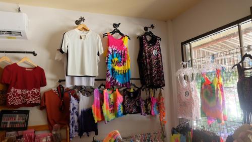 a room with many different types of dresses on display at Captan Home in Haad Chao Phao