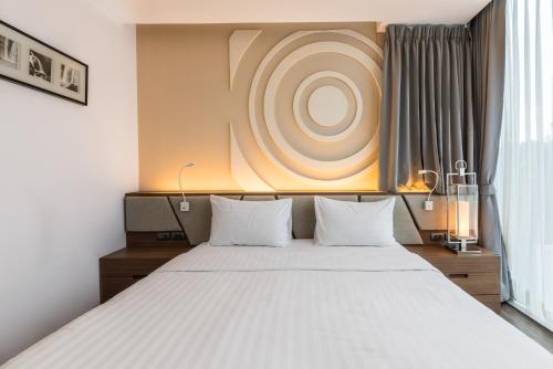 Postel nebo postele na pokoji v ubytování Olive Hotel Bangkok 64