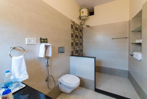 a bathroom with a toilet and a shower at Jaswant Niwas in Jodhpur