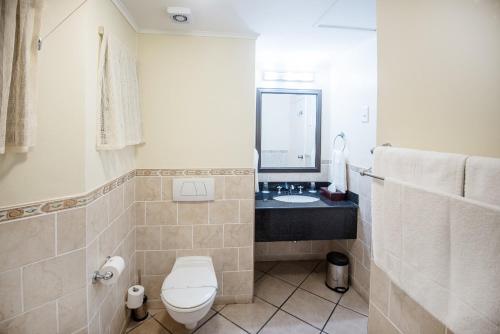 a bathroom with a toilet and a sink at First Group La Cote D'Azur in Margate