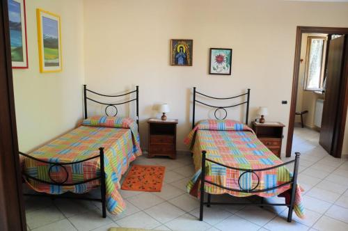 Posteľ alebo postele v izbe v ubytovaní Affittacamere della Paolina