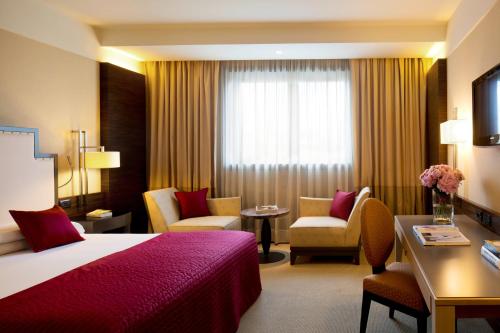 מיטה או מיטות בחדר ב-Starhotels Grand Milan