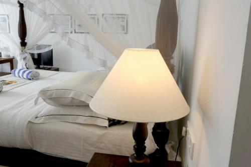 Postel nebo postele na pokoji v ubytování Sea World Boutique Hotel