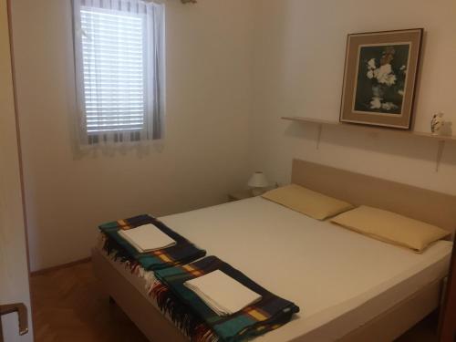 Posteľ alebo postele v izbe v ubytovaní Apartments Lavanda