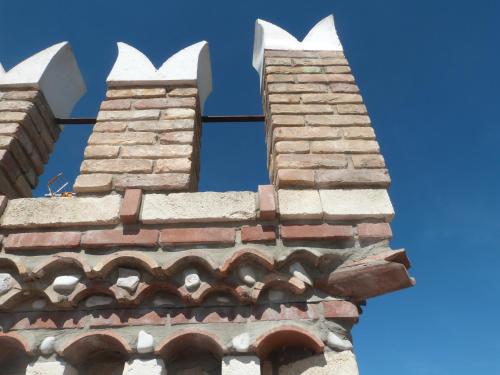 two chimneys on top of a brick building at Country House 3Quatrì in Corropoli