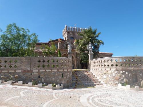 a stone wall with a staircase in front of a building at Country House 3Quatrì in Corropoli