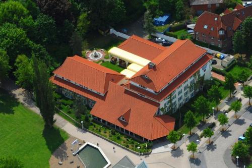 an overhead view of a building with an orange roof at Parkhotel Stader Hof in Stade