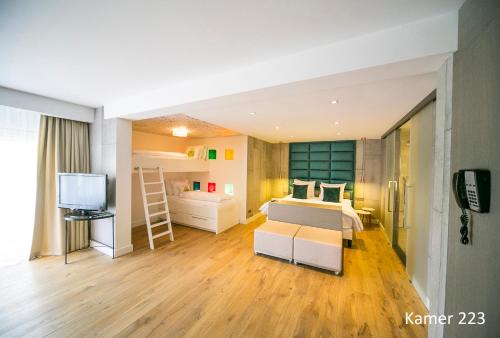 a room with two beds and a television in it at Van der Valk Hotel Assen in Assen