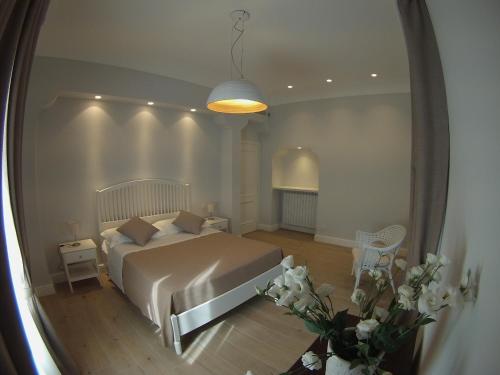 a bedroom with a bed and a large mirror at Fondo Santa Lucia in SantʼAgata sui Due Golfi