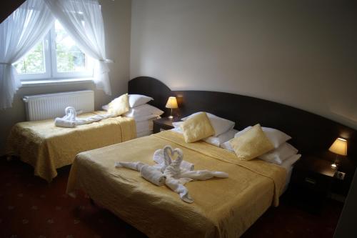 Postel nebo postele na pokoji v ubytování Villa Stella SPA