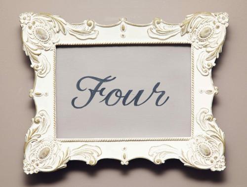 a picture frame with the word tour written on it at Flower Pot Hotel in Sunbury