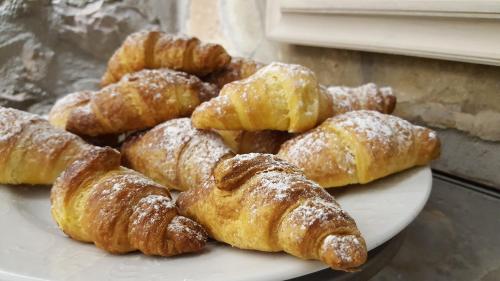 a plate of pastries sitting on a table at Hotel Villa San Giorgio in Poggibonsi