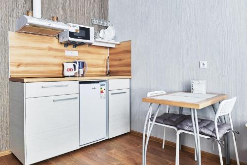 A cozinha ou cozinha compacta de Studio Apartment Luks
