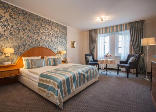 Postel nebo postele na pokoji v ubytování Hotel Rech