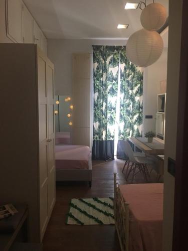 Una cama o camas en una habitación de Mosaico B&B