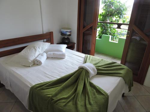 Giường trong phòng chung tại Castelo da Ilha