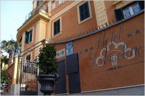 a building with graffiti on the side of it at San Anselmo in Rome