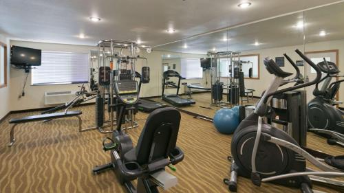 a gym with several treadmills and exercise bikes at Best Western Tumwater-Olympia Inn in Tumwater