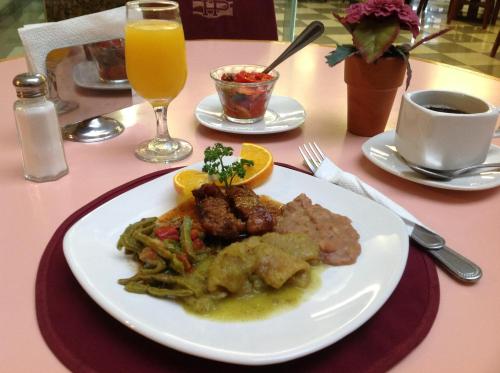 a white plate of food on a table at Best Western Hotel Plaza Matamoros in Matamoros