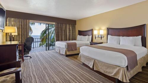 Krevet ili kreveti u jedinici u okviru objekta Best Western Fort Myers Waterfront