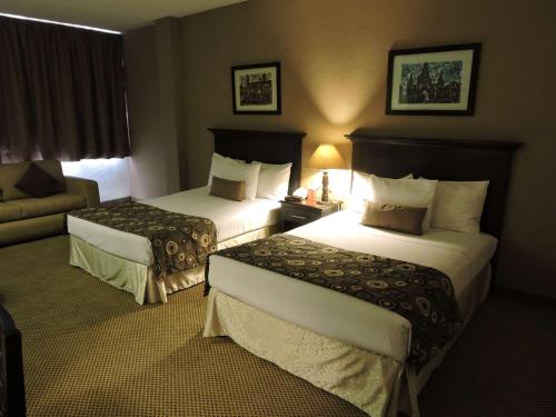 Ένα ή περισσότερα κρεβάτια σε δωμάτιο στο Best Western Posada Del Rio