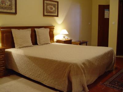 Ένα ή περισσότερα κρεβάτια σε δωμάτιο στο Hotel Jardim