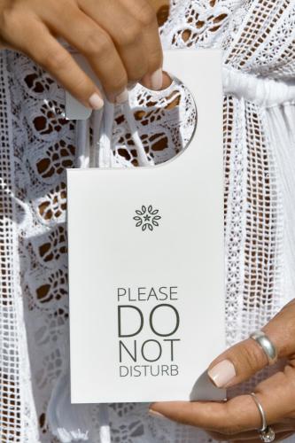 a woman holding a piece of paper with her hand at Nova Luxury Suites in Pirgos