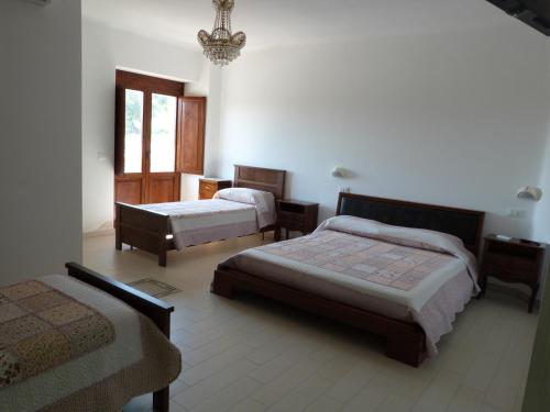Кровать или кровати в номере Country House 3Quatrì