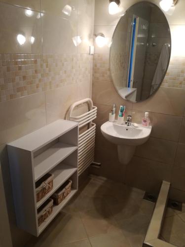 a bathroom with a sink and a mirror at Villa Nostra - Kruče in Ulcinj