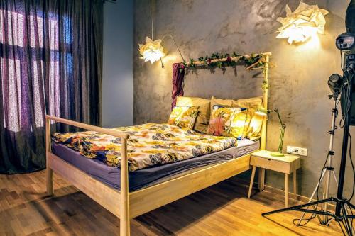 a bedroom with a bed in a room with a camera at SummerStreetSeven in Budapest
