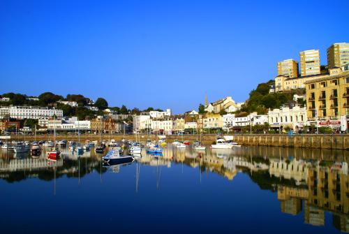 a group of boats are docked in a harbor at The Hotel Balmoral - Just for Adults in Torquay
