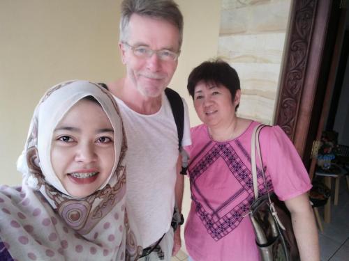 a man and a woman standing next to each other at Roemah Canting Homestay in Yogyakarta