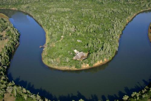 an island in the middle of a body of water at Sibuya Game Reserve and Lodge in Kenton on Sea