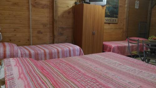 A bed or beds in a room at Chalet Don Bosco