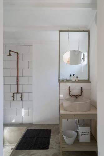 a bathroom with a sink and a mirror at Kleinkloof Farm in Piketberg