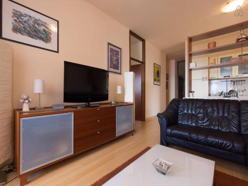 A television and/or entertainment centre at Luxury front row designer apartment