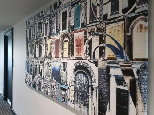 a mural on the wall of a building at The Westbridge Hotel Stratford in London
