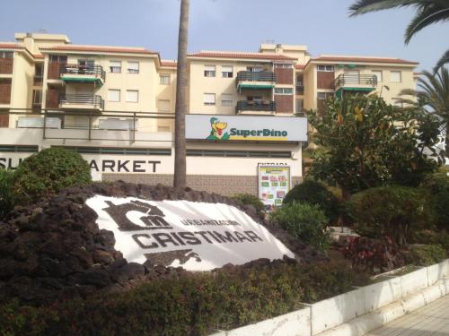 a large sign in front of a building at Rooms Complex "Cristimar", Los Cristianos in Los Cristianos