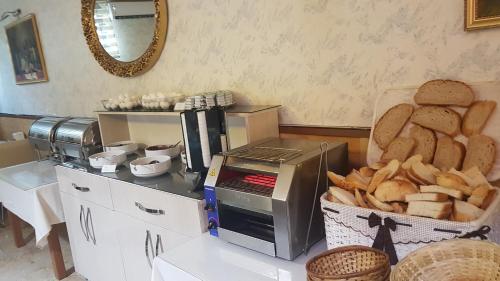 a table with a basket of bread and a microwave at Selimiye Palace in Edirne