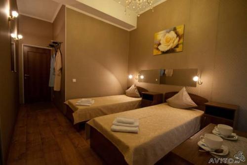 Ένα ή περισσότερα κρεβάτια σε δωμάτιο στο Guest House Geralda on Marata 14