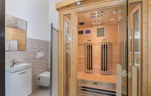 a shower in a bathroom with a toilet and a sink at Villa Tina Porec in Poreč