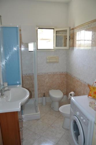 a bathroom with a toilet and a sink and a shower at Casa Vacanze Da Nonna Maria in Guardiagrele